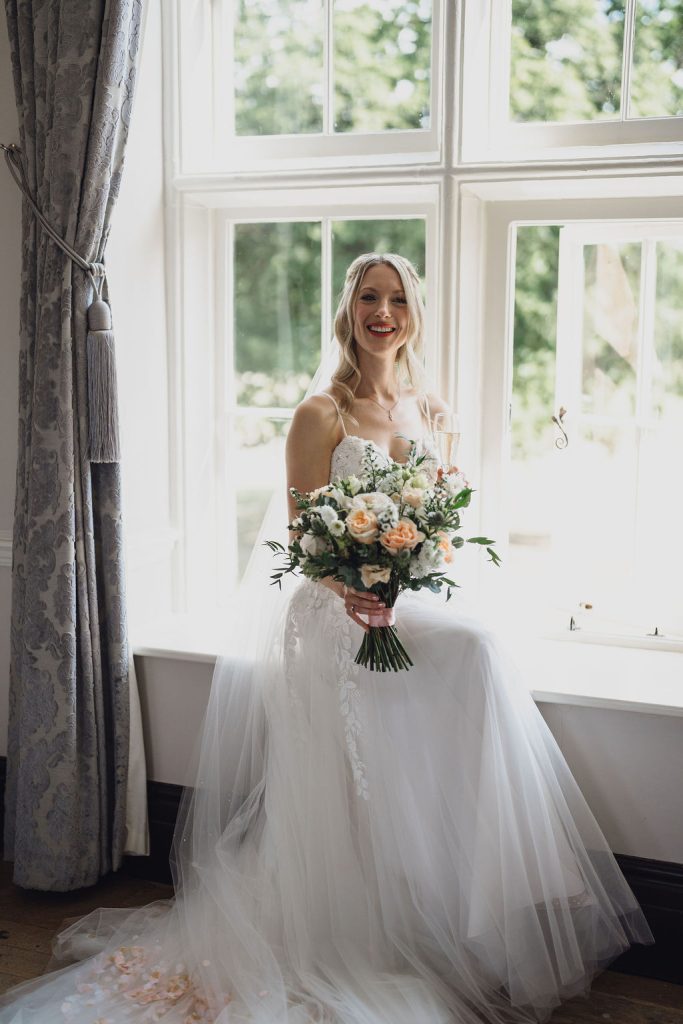 Vale Royal Abbey Weddings Bride in Window
